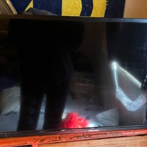 Hisense roku tv. With wall mount. 28in by 16in